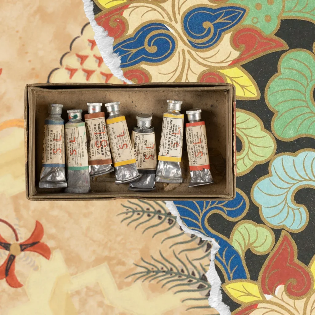 A colorful assemblage of Japanese wallpaper and a box of paints