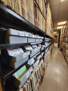 Records line a shelf down a long hallway. Photo by Holly Wilson.