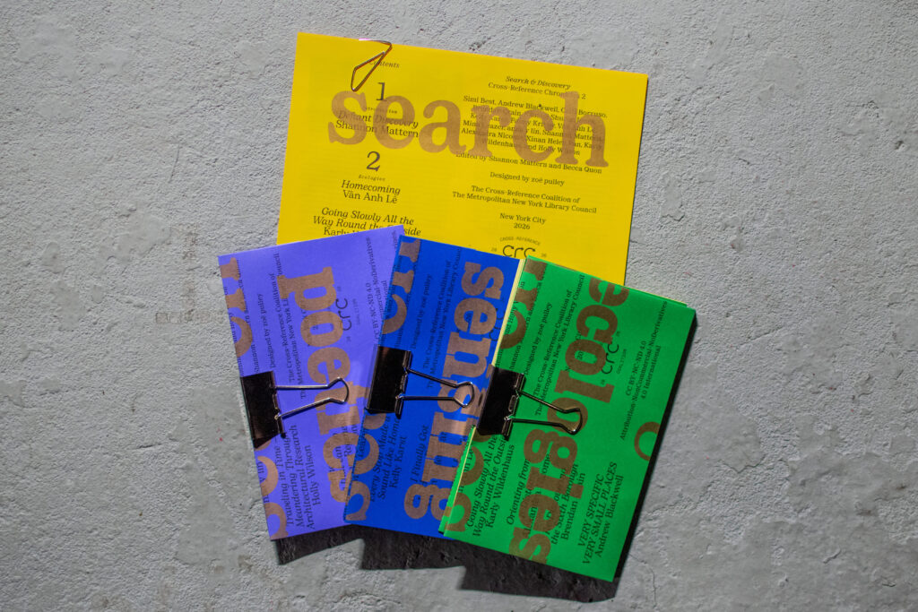 Three zines in shades of blue and green arrayed with a yellow broadsheet behind them.
